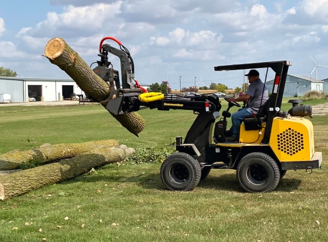 774R Compact Loader with Grapple accessory